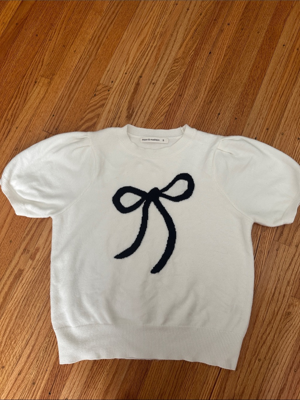 moon & madison Off White Short Puff Sleeve Sweater with Black Bow